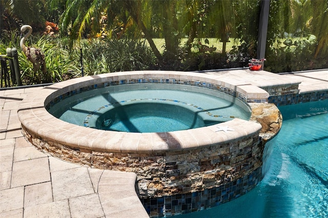 6231 Cypress Bend Ct, University Park, FL 34201 - view of pool with a pool with connected hot tub