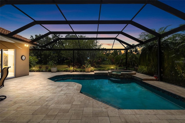 6231 Cypress Bend Ct, University Park, FL 34201 - pool at dusk with a patio and a pool with connected hot tub