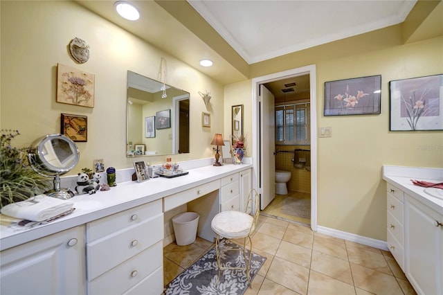 bathroom with tile patterned floors, ornamental molding, baseboards, and vanity