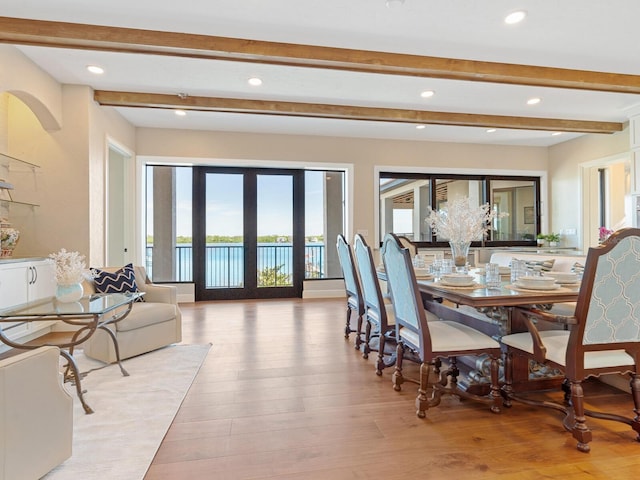 dining space featuring recessed lighting, light wood-style flooring, and beamed ceiling