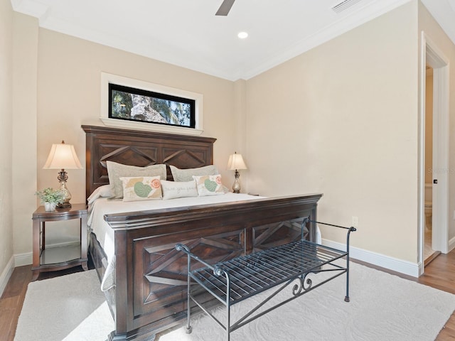 bedroom featuring crown molding, ceiling fan, baseboards, recessed lighting, and wood finished floors