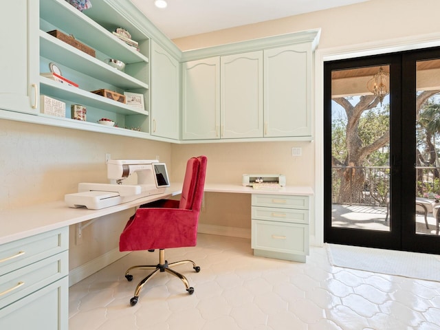 office featuring french doors, baseboards, and built in study area
