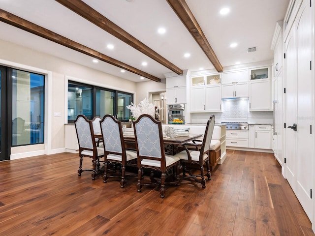 dining space featuring beam ceiling, visible vents, dark wood-type flooring, and recessed lighting