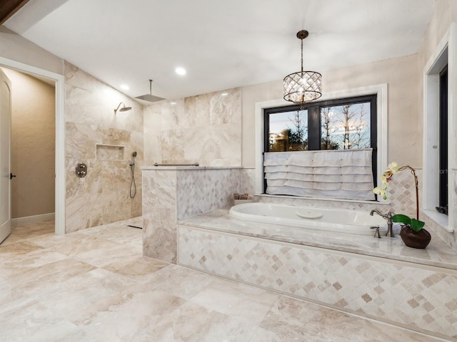 bathroom with a walk in shower, a garden tub, and marble finish floor