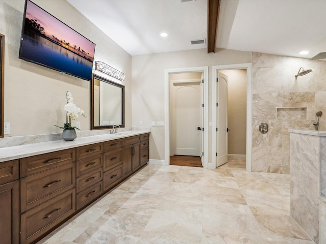 bathroom with visible vents, walk in shower, vanity, and marble finish floor