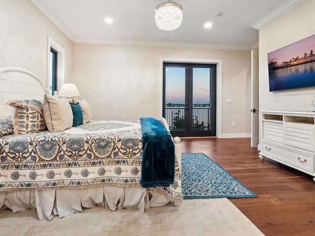 bedroom featuring wood finished floors, access to outside, ornamental molding, baseboards, and french doors