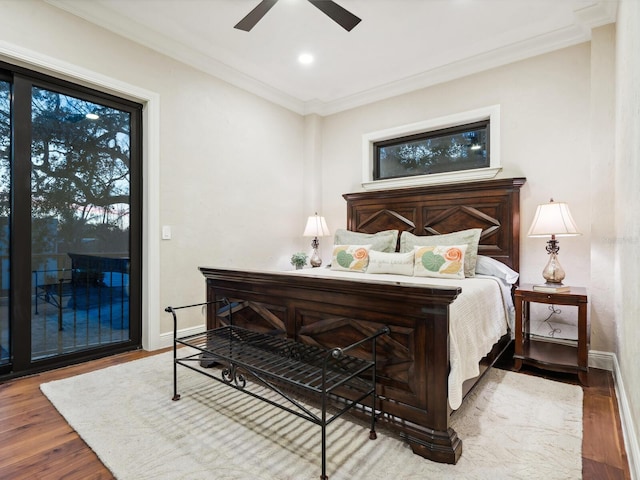 bedroom featuring baseboards, wood finished floors, access to outside, and ornamental molding
