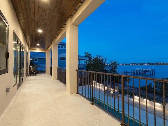 balcony featuring a water view