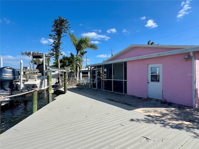 view of dock with boat lift