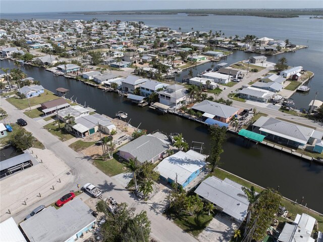 birds eye view of property featuring a water view and a residential view