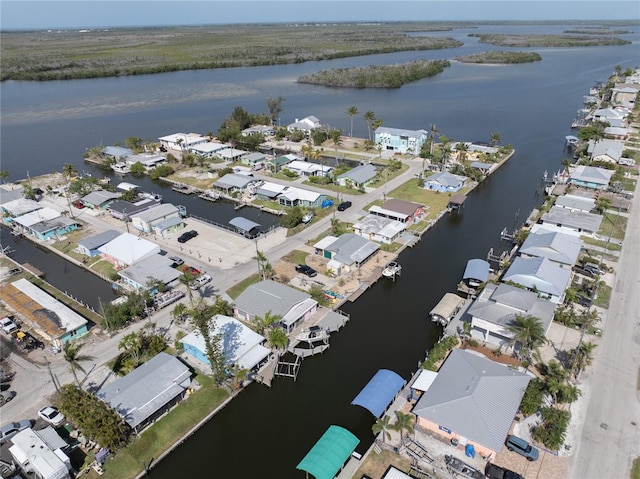 bird's eye view featuring a residential view and a water view