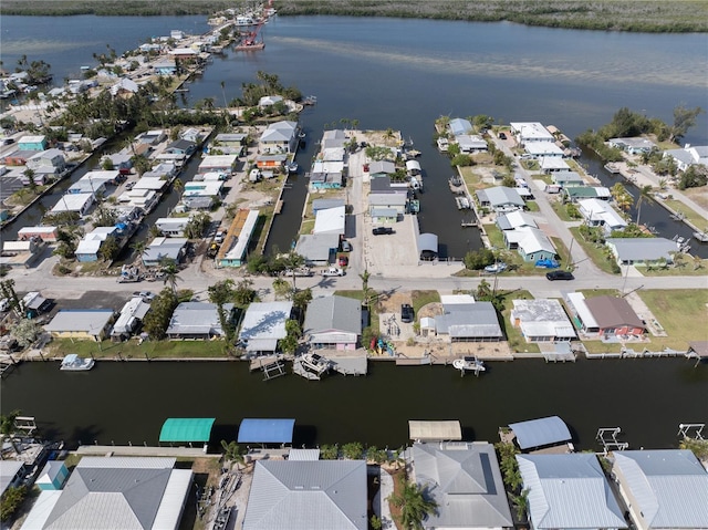 birds eye view of property featuring a water view and a residential view