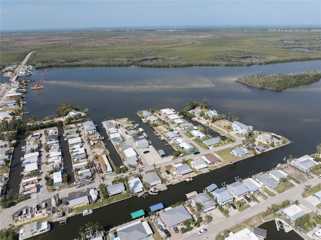 drone / aerial view with a residential view and a water view