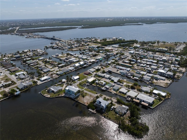 bird's eye view featuring a water view and a residential view