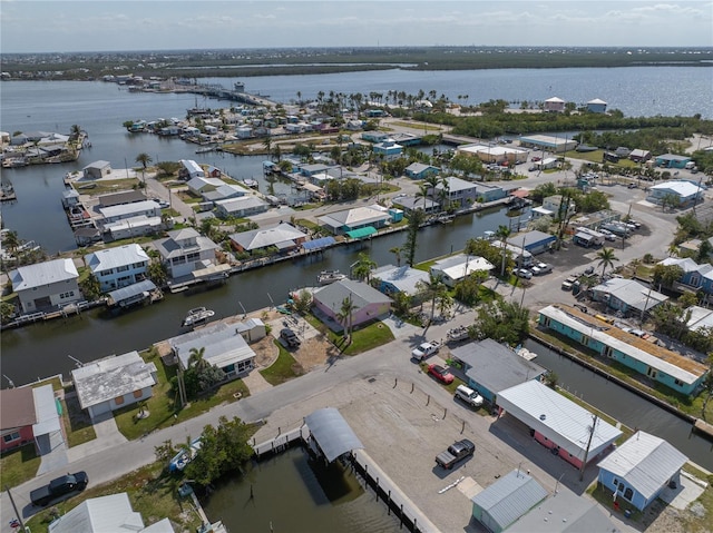 birds eye view of property with a residential view and a water view