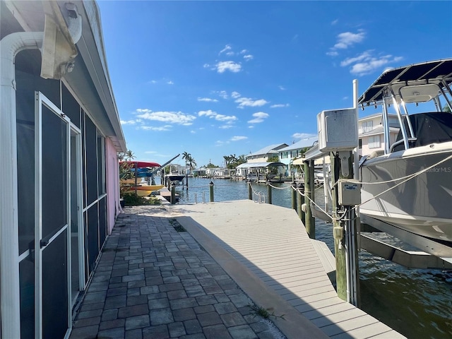 view of dock with a water view and boat lift