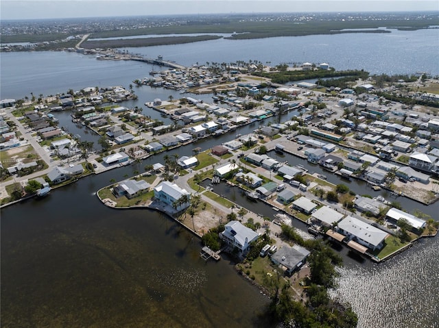 birds eye view of property with a residential view and a water view