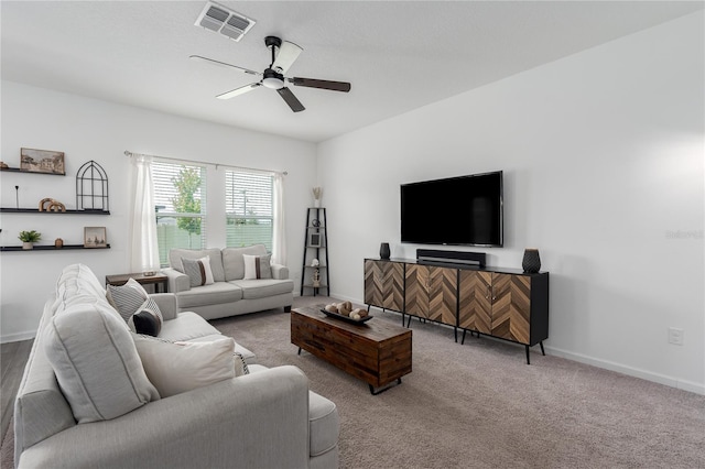 10464 Ladybug Cv, Parrish, FL 34219 - living area featuring ceiling fan, baseboards, and carpet floors