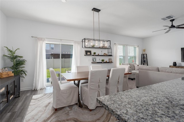 10464 Ladybug Cv, Parrish, FL 34219 - dining area with wood finished floors and ceiling fan