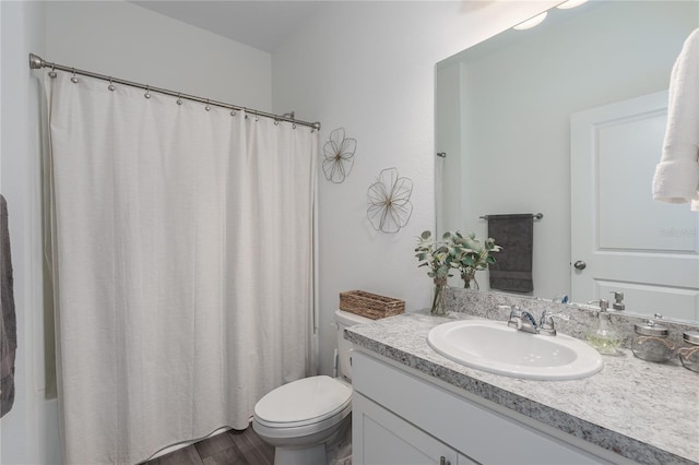 10464 Ladybug Cv, Parrish, FL 34219 - full bath featuring vanity, toilet, wood finished floors, and curtained shower