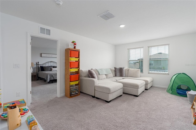 10464 Ladybug Cv, Parrish, FL 34219 - living room featuring carpet, recessed lighting, and baseboards