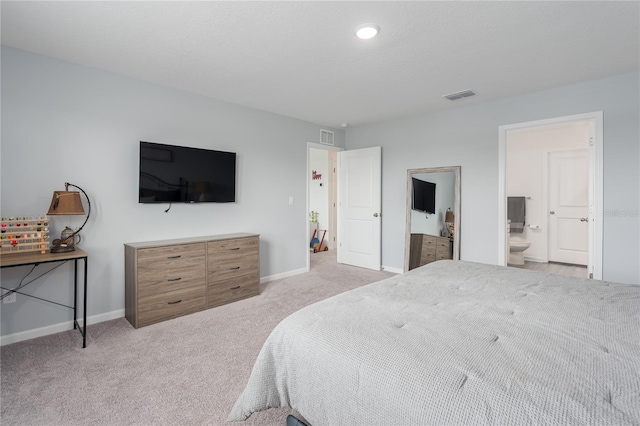 10464 Ladybug Cv, Parrish, FL 34219 - bedroom featuring light colored carpet, baseboards, ensuite bathroom, and recessed lighting