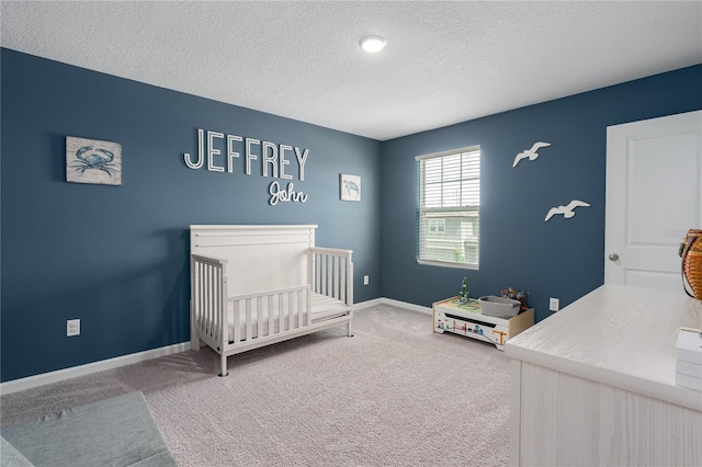 10464 Ladybug Cv, Parrish, FL 34219 - bedroom featuring carpet, a textured ceiling, a crib, and baseboards