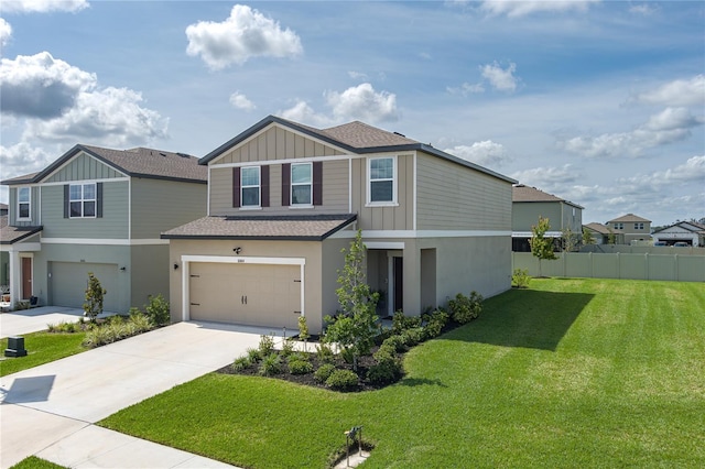 10464 Ladybug Cv, Parrish, FL 34219 - view of front of house featuring roof with shingles, an attached garage, driveway, and board and batten siding