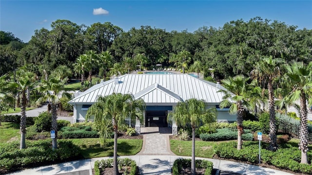 10464 Ladybug Cv, Parrish, FL 34219 - view of front of home with metal roof and a standing seam roof