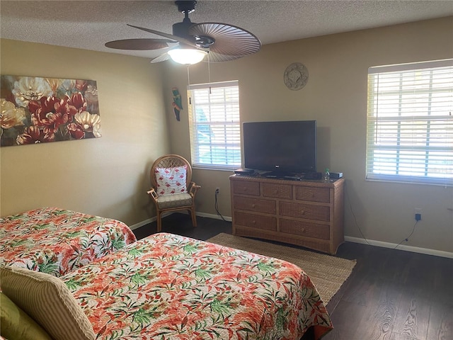 5712 34th Ct W, Bradenton, FL 34210 - bedroom with baseboards, ceiling fan, a textured ceiling, and wood finished floors