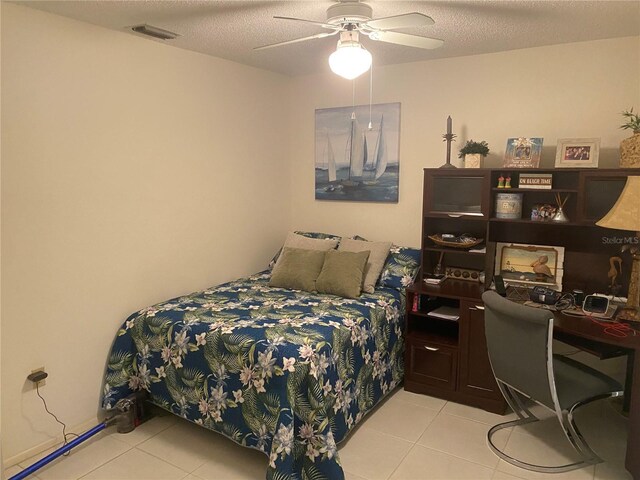 5712 34th Ct W, Bradenton, FL 34210 - bedroom featuring light tile patterned floors, a ceiling fan, and visible vents