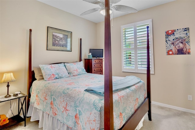 bedroom with carpet, ceiling fan, and baseboards