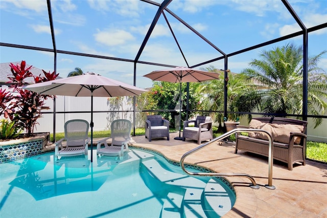 outdoor pool featuring outdoor lounge area, a patio, and glass enclosure