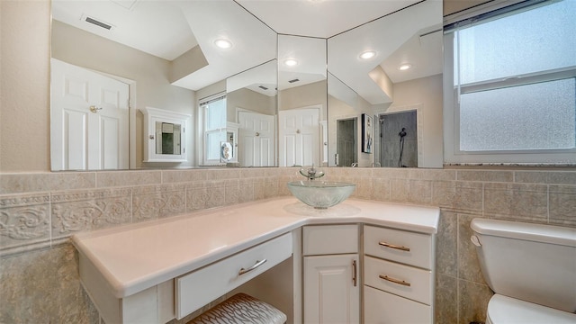 4861 Waterbridge Down, Sarasota, FL 34235 - bathroom with tile walls, vanity, and a shower