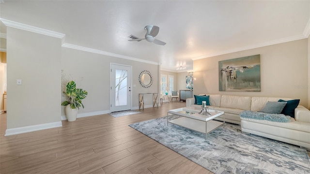 4861 Waterbridge Down, Sarasota, FL 34235 - living area featuring ornamental molding, ceiling fan, and wood finished floors