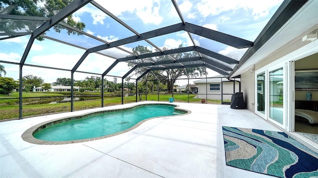4861 Waterbridge Down, Sarasota, FL 34235 - swimming pool featuring a patio area, a water view, and a yard