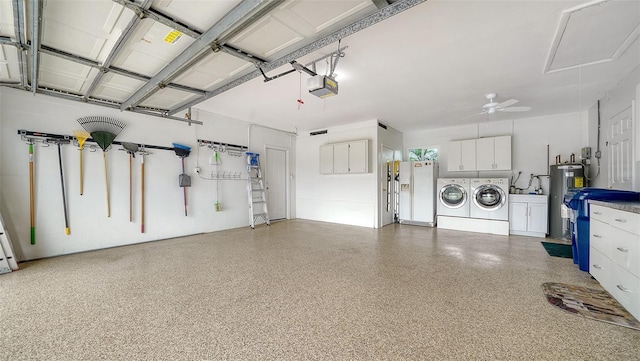 4861 Waterbridge Down, Sarasota, FL 34235 - garage featuring separate washer and dryer, water heater, a garage door opener, and ceiling fan