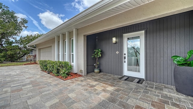 4861 Waterbridge Down, Sarasota, FL 34235 - property entrance with a garage and driveway