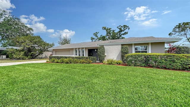 4861 Waterbridge Down, Sarasota, FL 34235 - single story home with stucco siding, an attached garage, a front lawn, and driveway