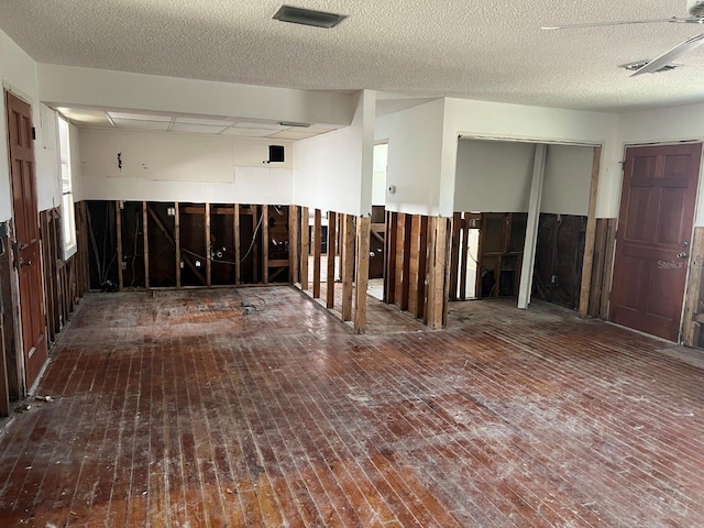 7030 Lois Ave, Longboat Key, FL 34228 - unfurnished room featuring visible vents and wood-type flooring
