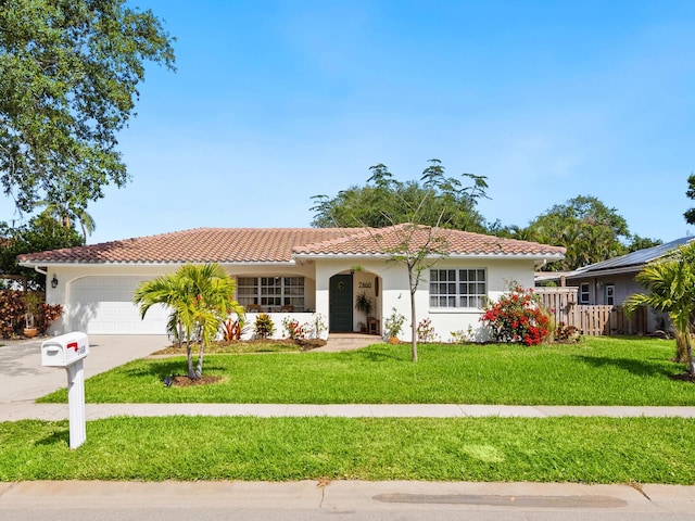 ranch-style home with a front lawn, stucco siding, concrete driveway, and an attached garage