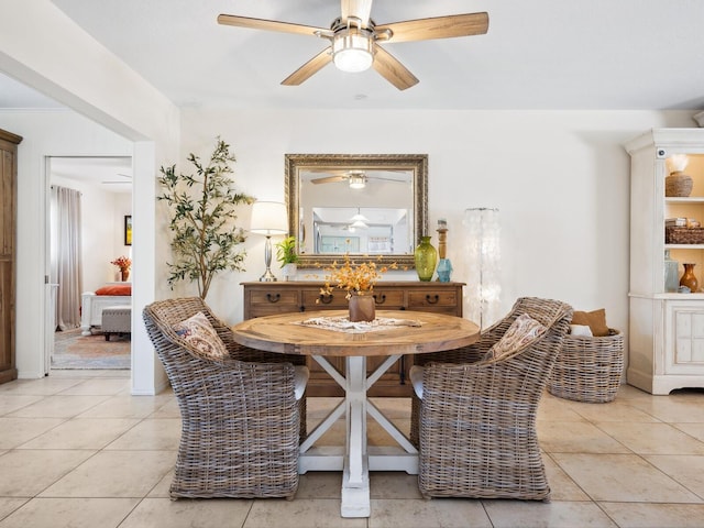 dining room with light tile patterned floors and a ceiling fan