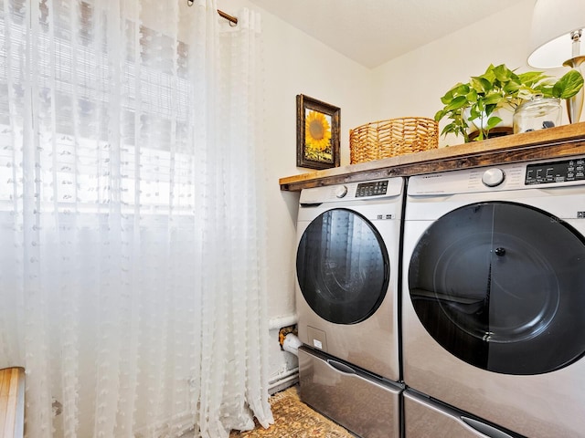 clothes washing area featuring laundry area and independent washer and dryer