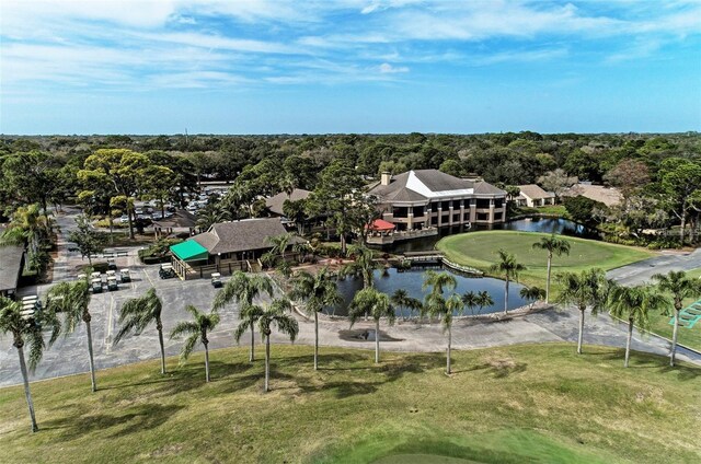 exterior space featuring view of golf course and a water view