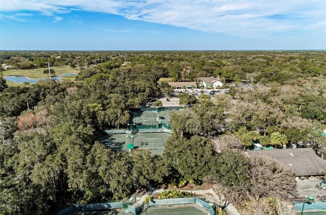 birds eye view of property featuring a wooded view
