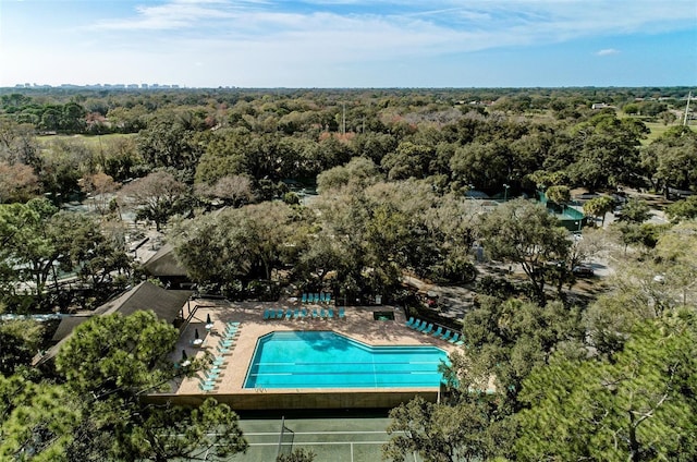 birds eye view of property with a wooded view