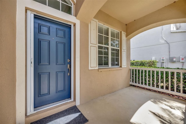 14315 Tree Swallow Way, Lakewood Ranch, FL 34202 - property entrance with stucco siding and covered porch