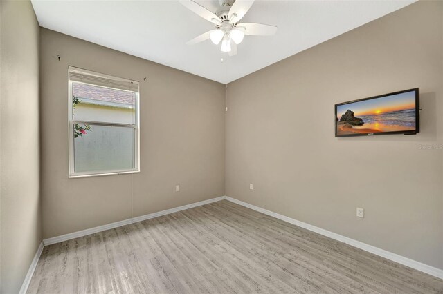 14315 Tree Swallow Way, Lakewood Ranch, FL 34202 - spare room featuring wood finished floors, a ceiling fan, and baseboards