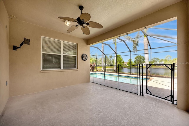 14315 Tree Swallow Way, Lakewood Ranch, FL 34202 - view of patio / terrace with ceiling fan, a water view, an outdoor pool, and a lanai