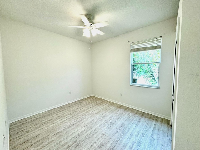 14315 Tree Swallow Way, Lakewood Ranch, FL 34202 - empty room featuring wood finished floors, ceiling fan, baseboards, and a textured ceiling